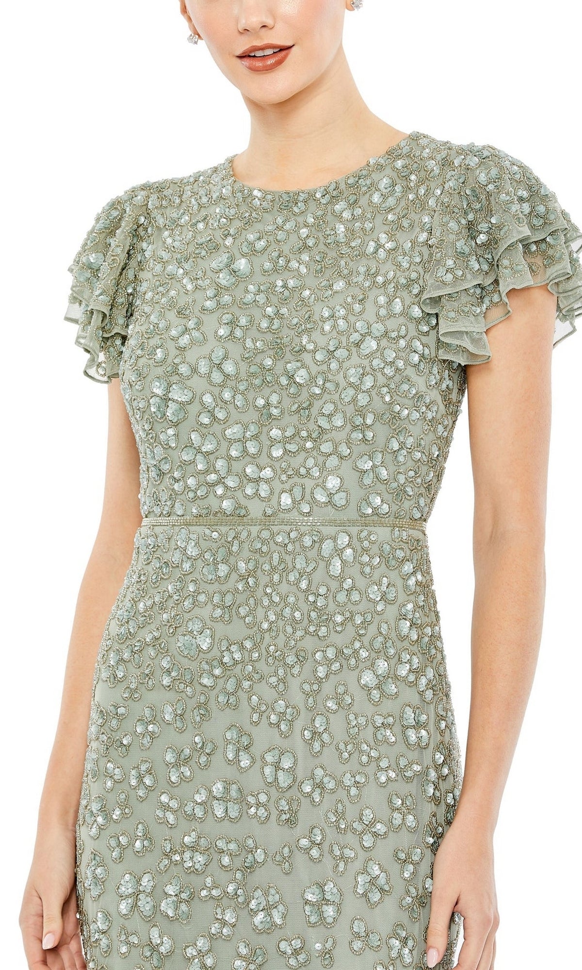 A woman wearing the Short Wedding Guest Dress 10771 by Mac Duggal—a fitted light green midi dress with ruffled short sleeves and all-over beaded embellishments, perfect for chic semi-formal occasions.